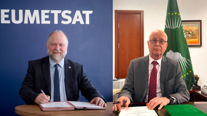 EUMETSAT to provide meteorological satellite data to African Union Commission Two executives sit with papers in front of them. One has the word EUMETSAT on the wall behind him, one has a green flag.