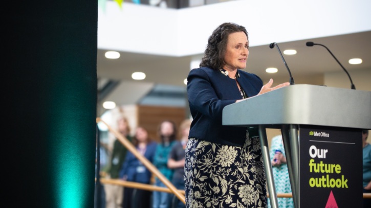 Prof Penny Endersby speaking at a lectern at the strategy launch in Met Office HQ.