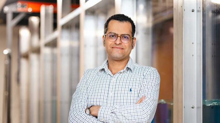 Dr Kianoosh Yousefi, assistant professor of mechanical engineering at The University of Texas at Dallas, smiles into the camera with his arms crossed
