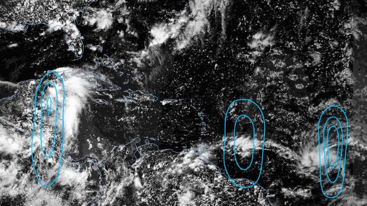A satellite image of the Atlantic shows three circular forms drawn on in blue.