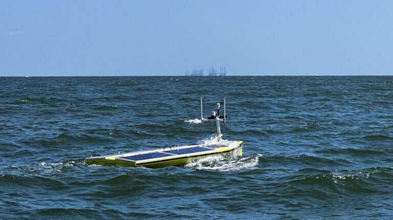 An SP-48 sensor floats on the ocean in the Gulf of Mexico. The water is calm.